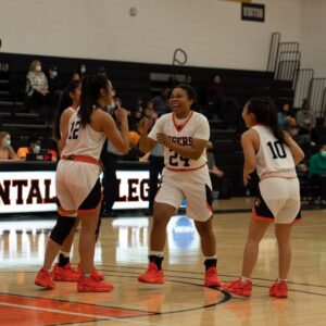 women play basketball