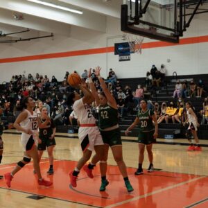 women play basketball
