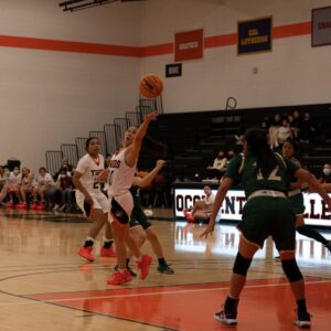women play basketball